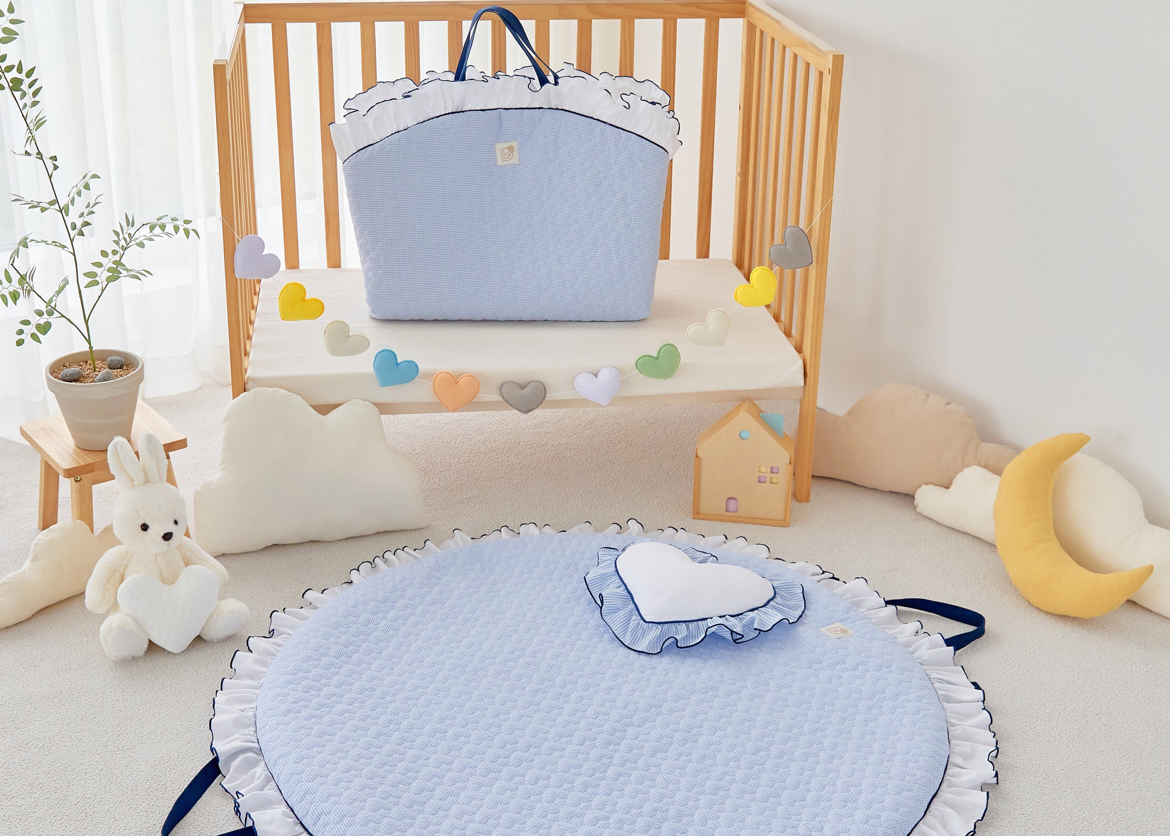 Baby quilted round portable play mat in heart pattern, sky blue and white navy ruffle.