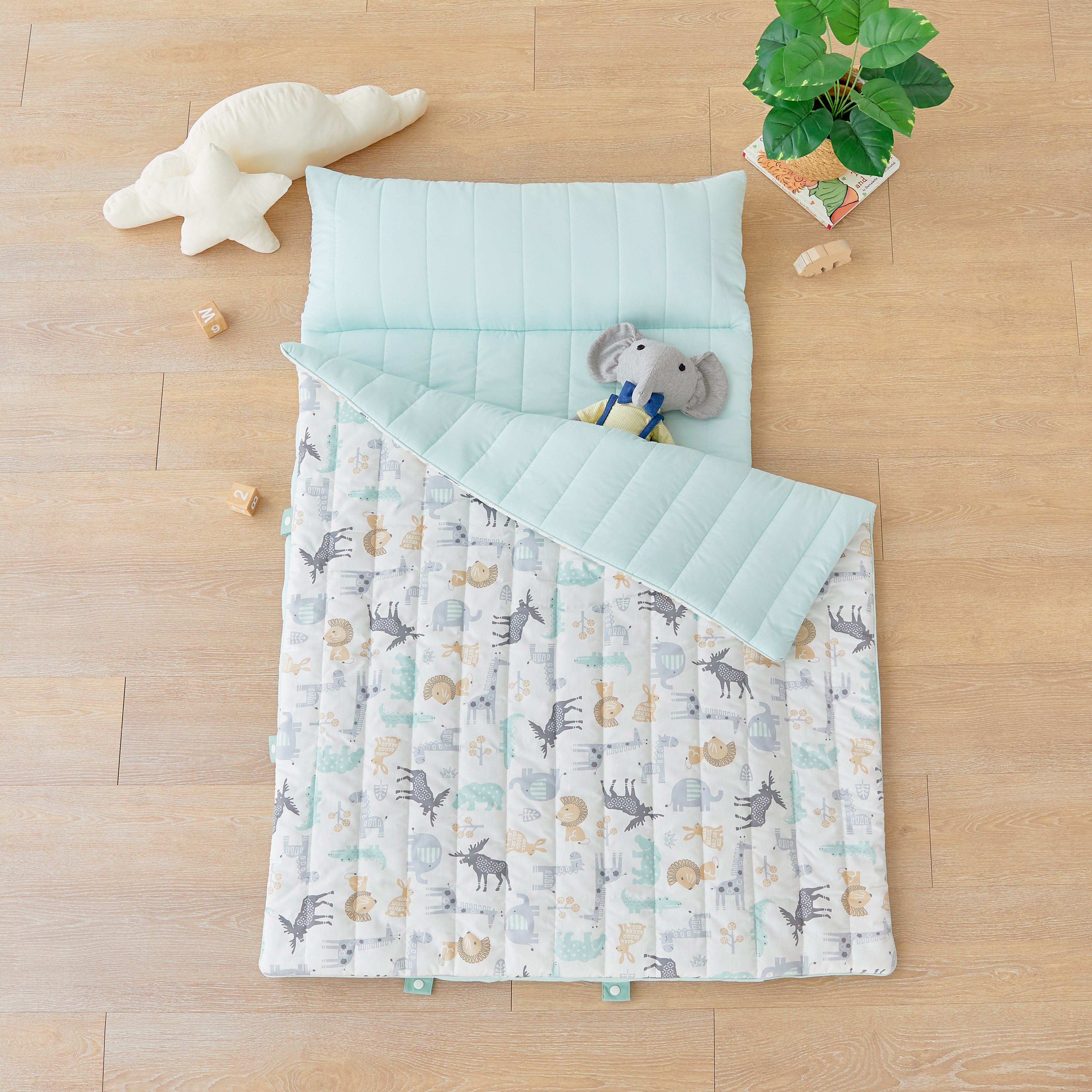 Children's quilt Baby Nap Mat Blanket Portable with Safari Zoo Animal pattern on a wooden floor with elephant doll