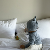 Baby wearing Cloud Soft Rib Knit Soft Blue Sweater styled with neutral leggings