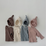 Four Cloud Soft Rib Knit Sweaters in ivory, brown, pink, and light blue by Loa Daisy