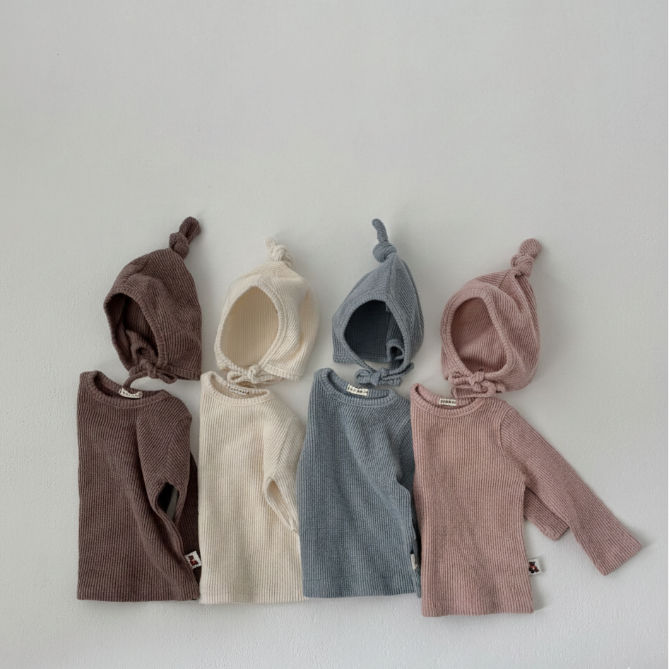 Four Cloud Soft Rib Knit Sweaters in ivory, brown, pink, and light blue by Loa Daisy