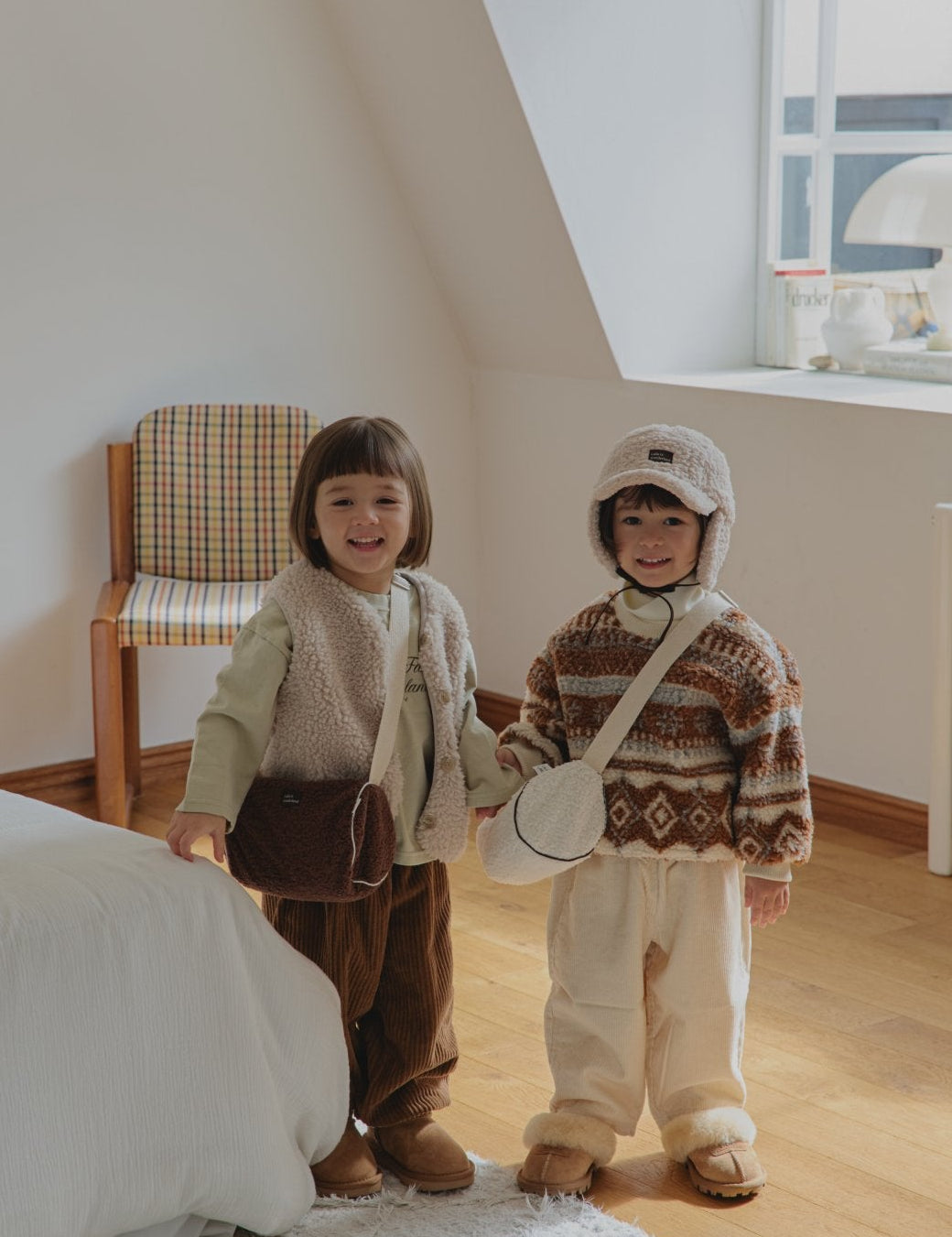 Toddlers wearing Corduroy Comfort Pants in brown and ivory— cozy fall winter outfit look