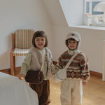 Toddlers wearing Corduroy Comfort Pants in brown and ivory— cozy fall winter outfit look