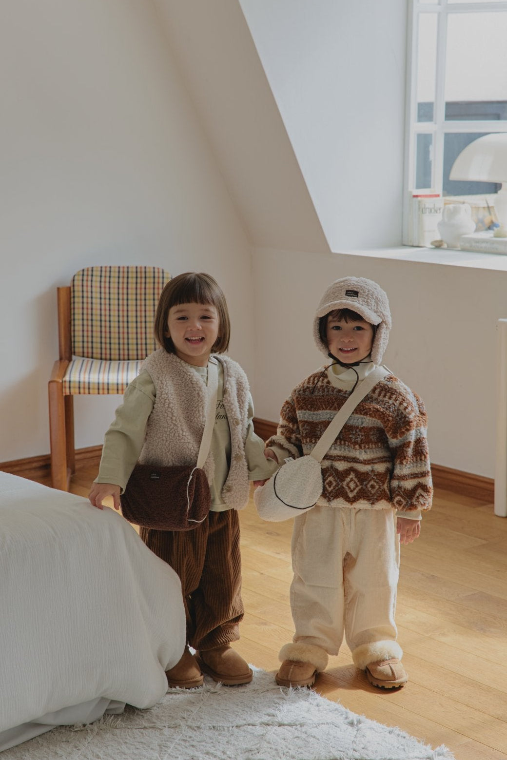 Toddlers wearing Corduroy Comfort Pants in brown and ivory— cozy fall winter outfit look
