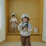 Toddler wearing Cloud Dumble Sweater Soft Check and brown corduroy cargo pants indoors for cozy fall and winter wear