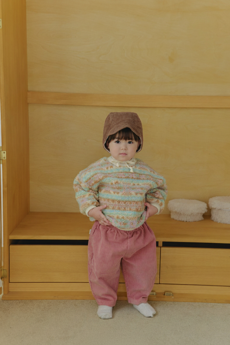 Baby wearing Corduroy Comfort Pink Pants paired with pink green sweater top for winter outfit