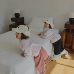 Toddlers wearing Corduroy Comfort Pants Rose Pink and pink purple dotted sweater — cozy holiday winter outfit look