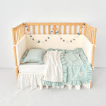 Cozy reversible mint blue gingham stroller blanket with ruffle trim and sherpa backing