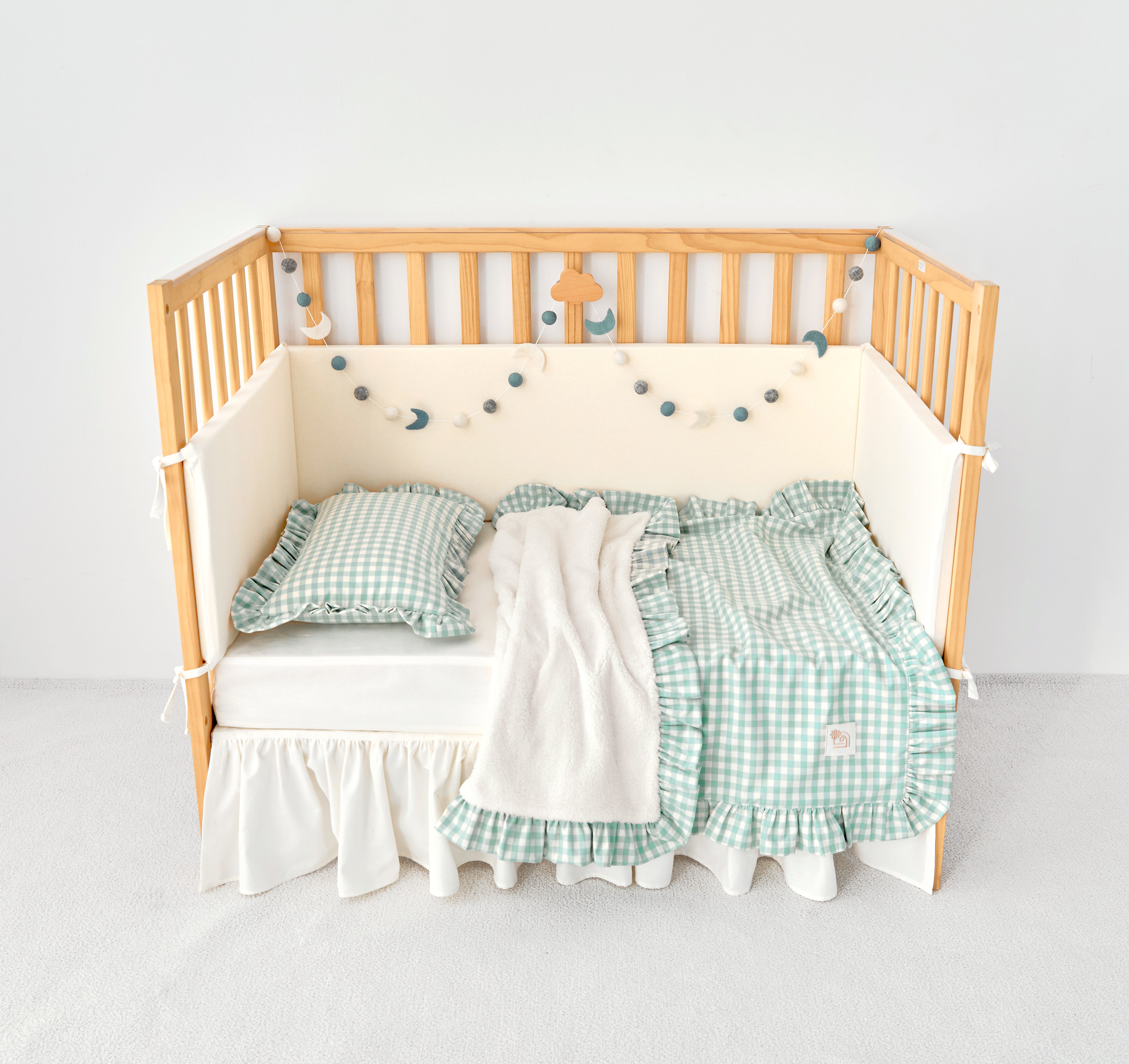 Cozy reversible mint blue gingham stroller blanket with ruffle trim and sherpa backing