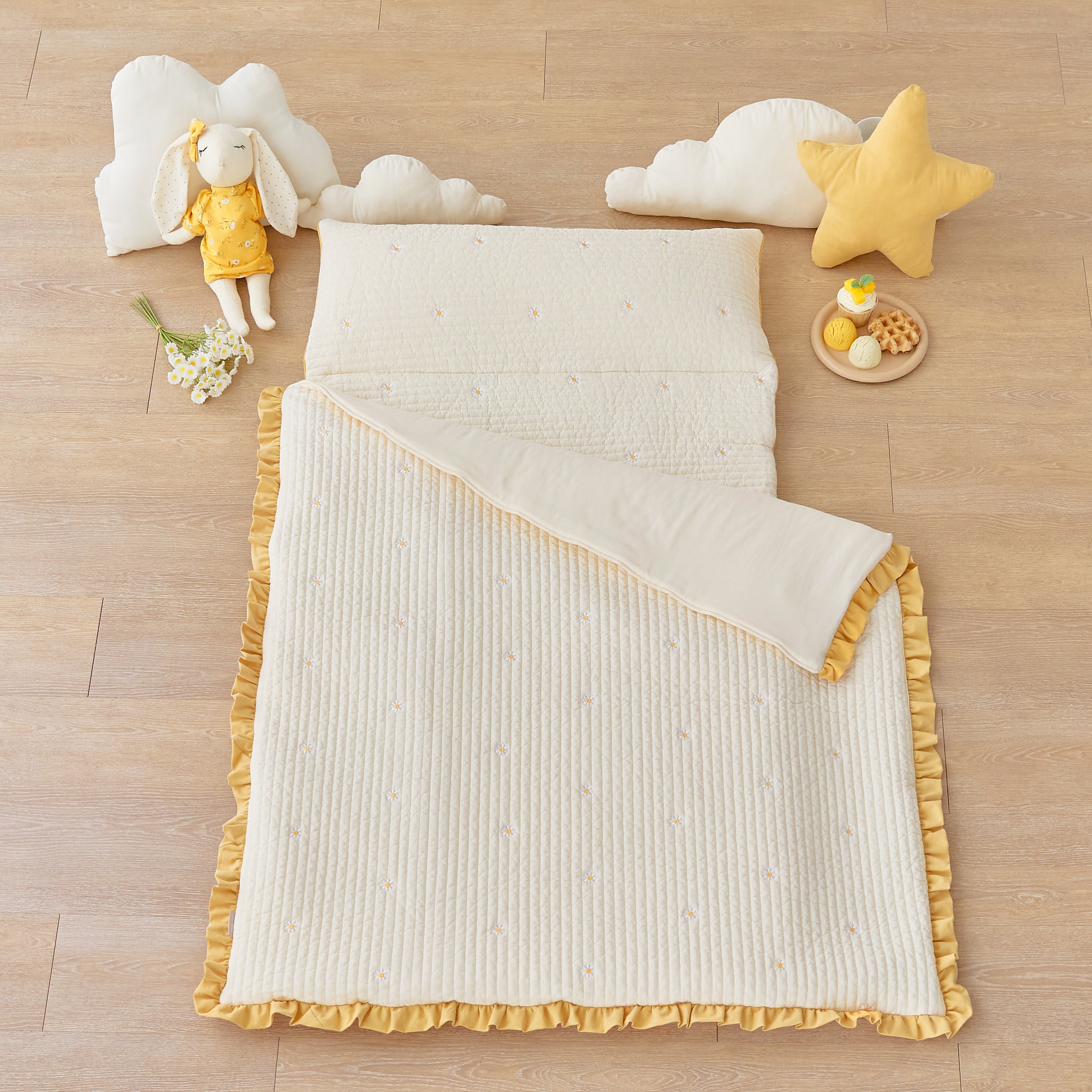 Daisy embroidered portable nap mat in ivory cotton with mustard ruffle and detachable blanket