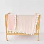 pink olive green ruffled blankets on a white background