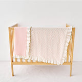 pink olive green ruffled blankets on a white background